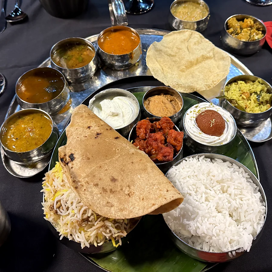 South Indian thali with biryani, chapati, rice and curries