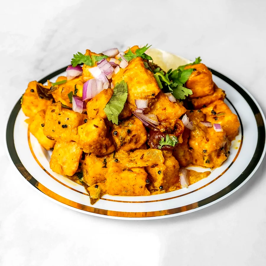 Tandoori tikka bites with red onion and cilantro